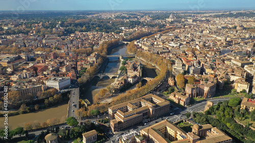 Aerial drone photo of Tiber island or Isola Tiberina, a small island in a bend of the River Tiber with a number of historical buildings and monuments, Rome historic centre, Italy