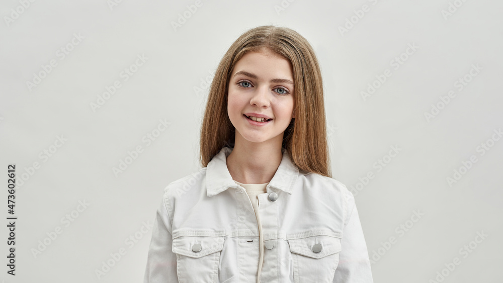 Portrait of smiling teenage girl child on white background Portrait of smiling teenage girl child on white background