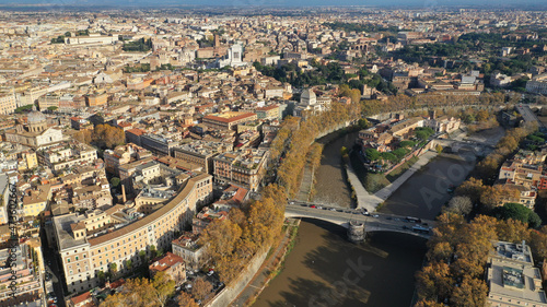 Aerial drone photo of Tiber island or Isola Tiberina, a small island in a bend of the River Tiber with a number of historical buildings and monuments, Rome historic centre, Italy © aerial-drone