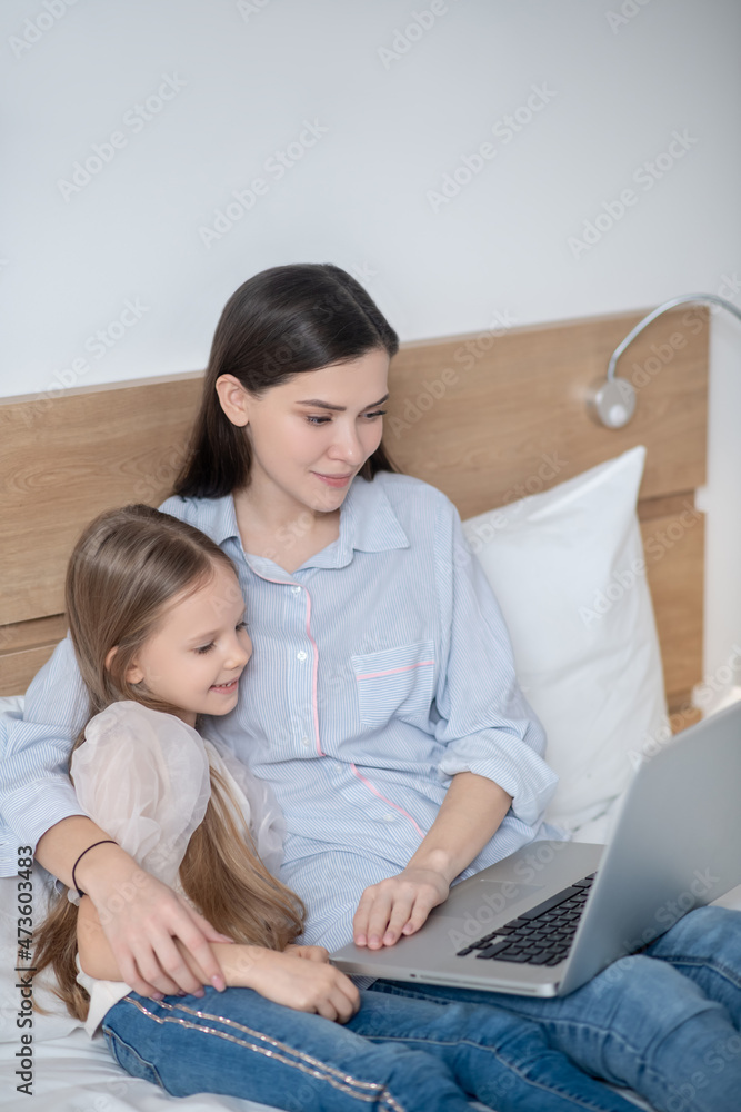 Mother and daughter using a notebook computer Mother and daughter using a notebook computer