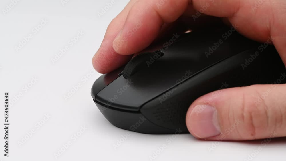 Clicking digital wireless mouse and working on computer at the office. Close up hand on mouse. The concept of using technology. Computer for business. Clicking digital wireless mouse and working on computer at the office. Close up hand on mouse. The concept of using technology. Computer for business.