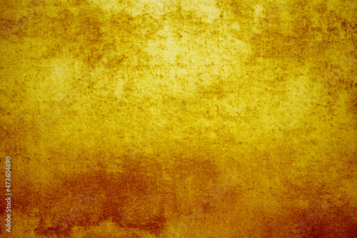 abstract background texture of aged  bright  grunge wall with structure in golden  orange or autumn color feel.