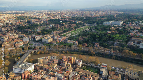 Aerial drone photo of iconic Circus Maximus a green space and remains of a stone - marble arena used for chariot races built next to Palatine hill and world famous Colosseum, historic Rome, Italy