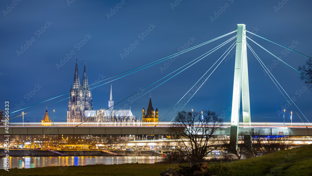 Famous Cologne Cathedral illuminated against dark winter sky Famous Cologne Cathedral illuminated against dark winter sky