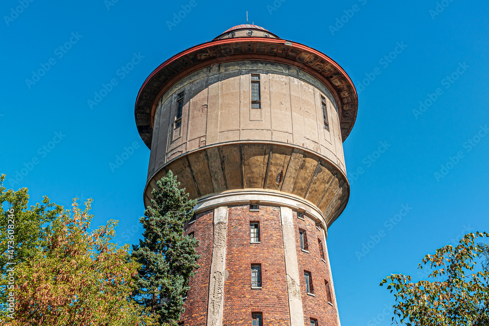old water tower against bright blue sky, Riga, Latvia