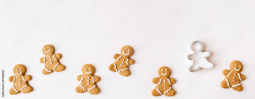 Banner made of Homemade gingerbread cookies on white background. Christmas, winter, new year composition. Flat lay, top view, copy space Banner made of Homemade gingerbread cookies on white background. Christmas, winter, new year composition. Flat lay, top view, copy space