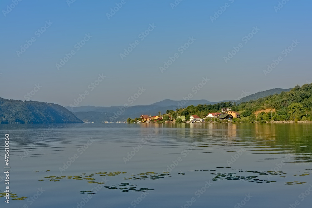 little village on a hill with forest in the Romanian countryside