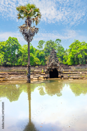 Neak Poan ruins at Angkor temple complex near Siem Reap, Cambodia. Artifactually island and pond at Wat Prasat Neak Pean, Cambodia. photo