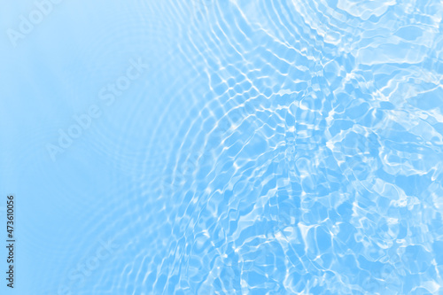 Fresh water background. Bright blue pattern with natural rippled water texture. Clear drinking water., sport hydration concept. Top view with copy space.