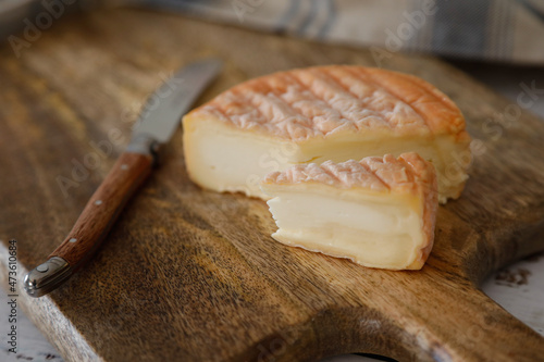 Epoisses, French cheese from Burgundy, on a wooden background