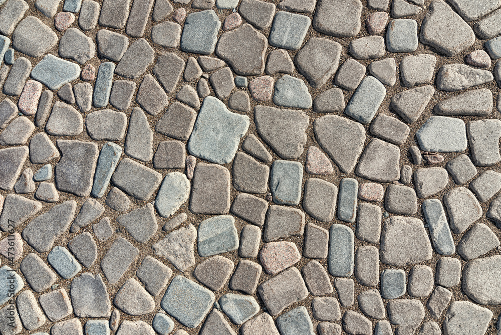 The texture of natural stone paving, background. The texture of natural stone paving, background.