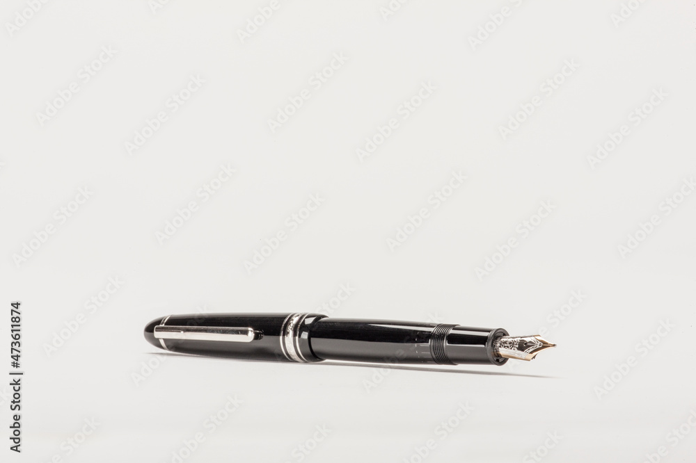 Low angle 3/4 studio shot of a modern dip pen (nib pen). Low angle 3/4 studio shot of a modern dip pen (nib pen).