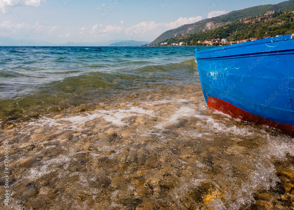Waves hit the boat on the lake shore, underwater Waves hit the boat on the lake shore, underwater