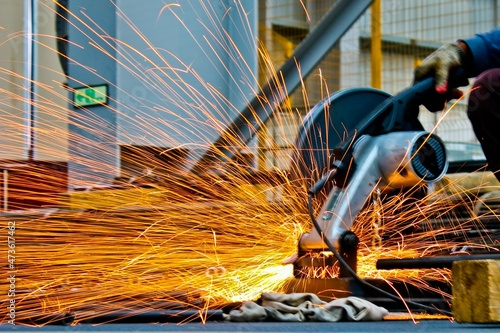 cut off saw cutting metal with sparks