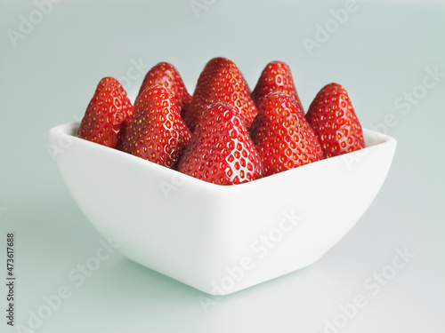 Strawberries in a square white bowl
