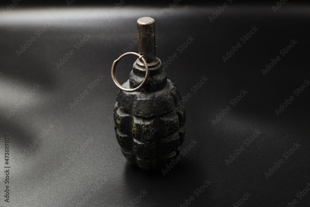 Fototapeta premium Rusty russian grenade of the second world war on black background