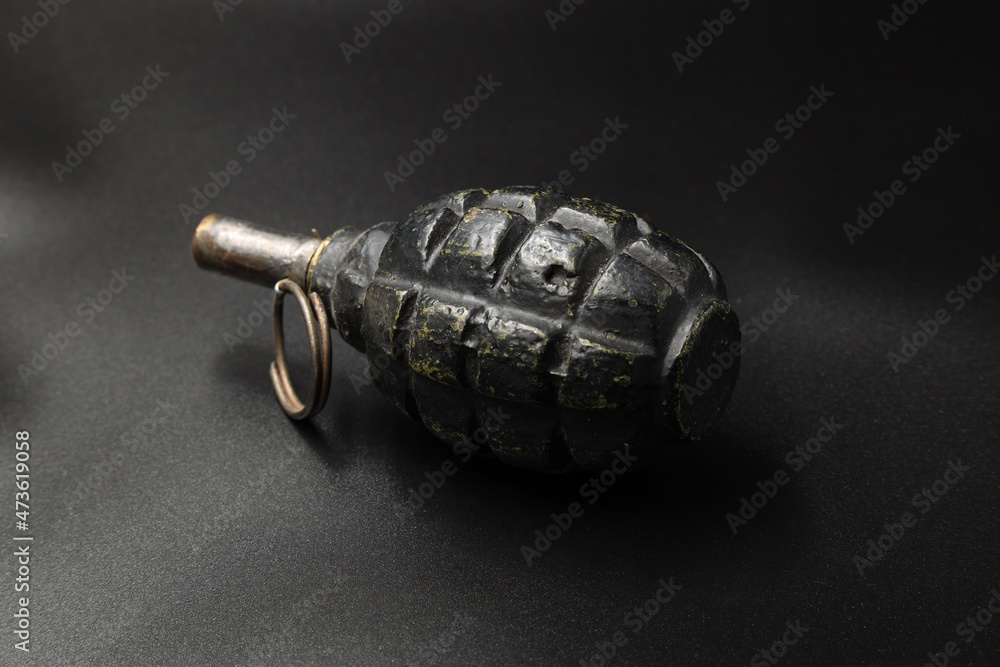Fototapeta premium Rusty russian grenade of the second world war on black background