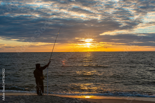Silhouette of Fisherman at Baltic Sea at Sunset, Estonia