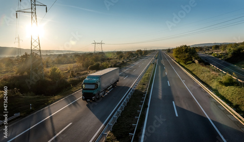 Big Lorry Truck on a rural countryside highway. Business Transportation And Trucking Industry
