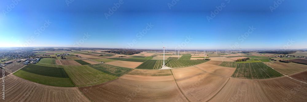 180 degree aerial panorama view of different colourful fields with wind turbines (windfarm). South Germany (Bermaringen): aerial view of different colourful fields with wind turbines (windfarm).