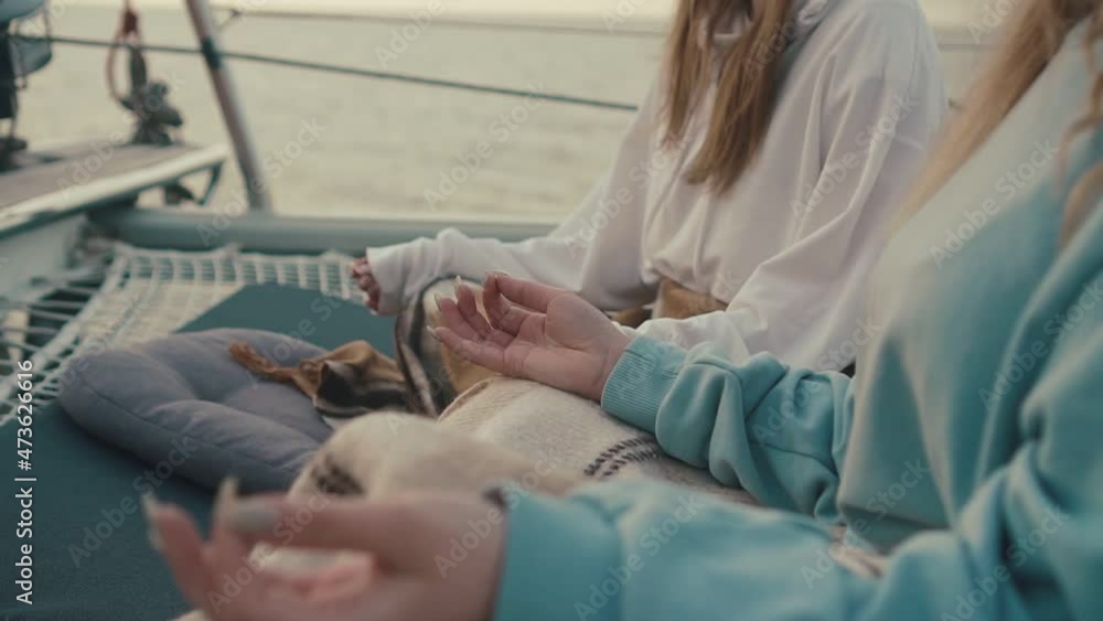 Meditation At Sunrise On The Sailing Yacht. Woman In The Lotus Position. Meditation At Sunrise On The Sailing Yacht. Woman In The Lotus Position.