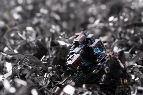 Perfect bismuth crystals macro on metal shavings.