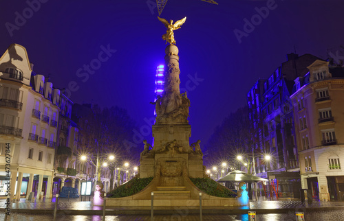 Ancient monumental fountain Sube with golden angel at top was erected in middle of Place d'Erlon. Champagne-ardenne, France photo