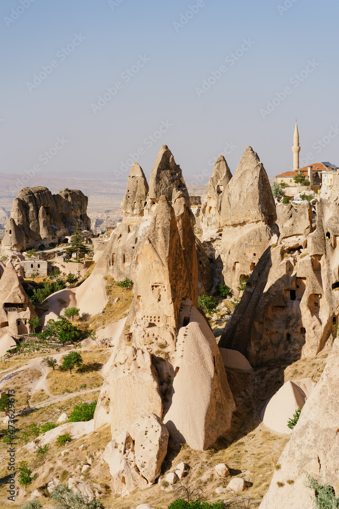 Picturesque summer view Scenic on landscape view of geologic formations of Cappadocia. Amazing shaped sandstone rocks. Famous touristic place and romantic travel destination..