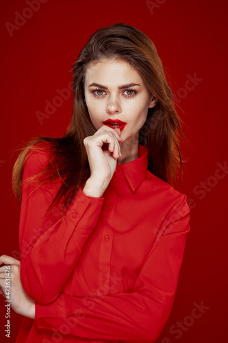 woman in red shirt posing fashion red lips fun