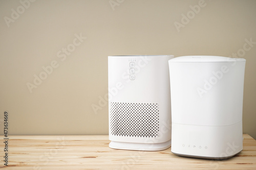 Modern humidifier and air purifier, space for text. photo