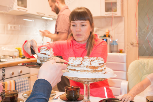 Celebration in the bosom of the family with a cake at the table