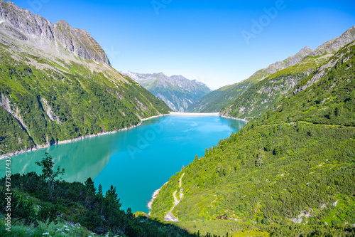 Beautiful alpine walley with azure blue water dam © pyty