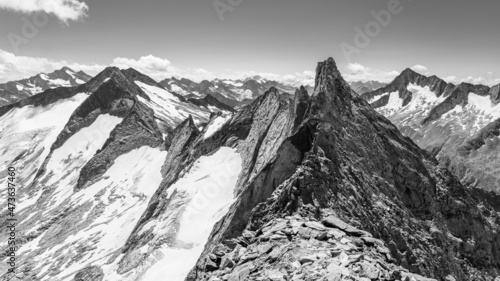 Pointed rocky mountain ridge on sunny summer day © pyty