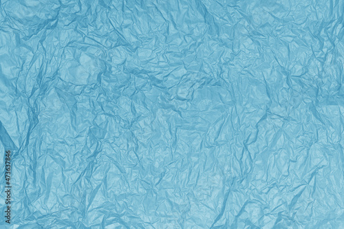 Crumpled paper texture. Abstract blue background  