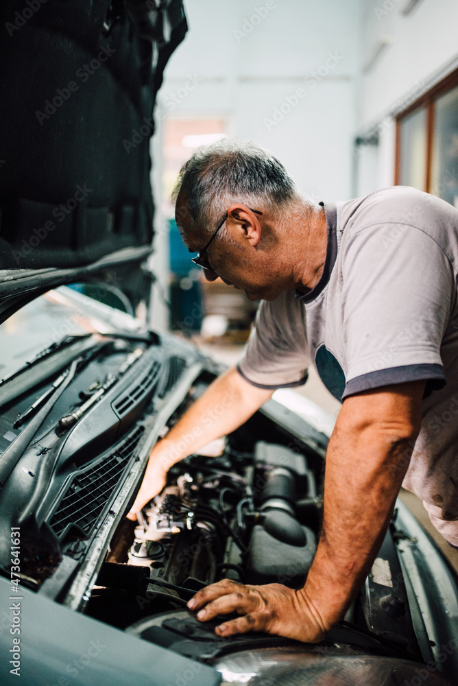 Process of repairing a car in the garage Process of repairing a car in the garage