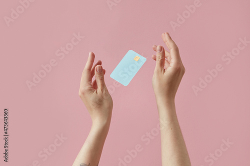 Woman catching credit card photo