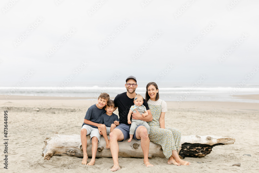 A Smiling Family Portrait on Beach A Smiling Family Portrait on Beach