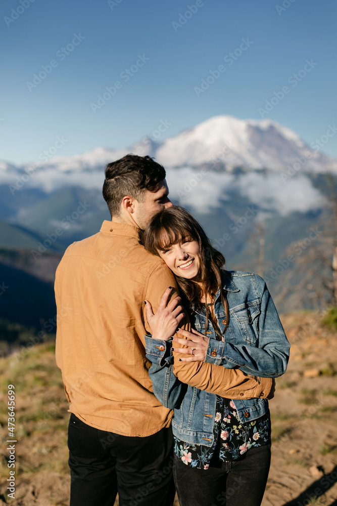 Smiling Couple Embraced on Mountain Smiling Couple Embraced on Mountain