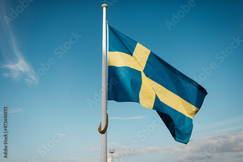 Swedish flag in blue sky photo