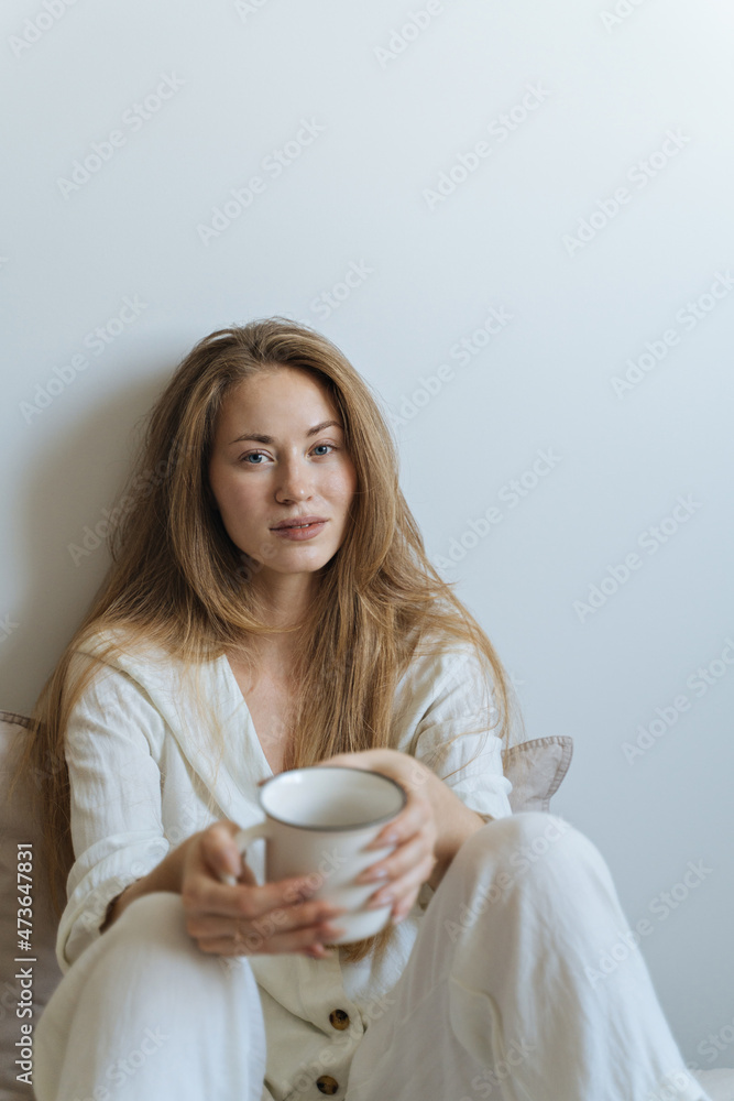 young woman in bed uses smartphone young woman in bed uses smartphone
