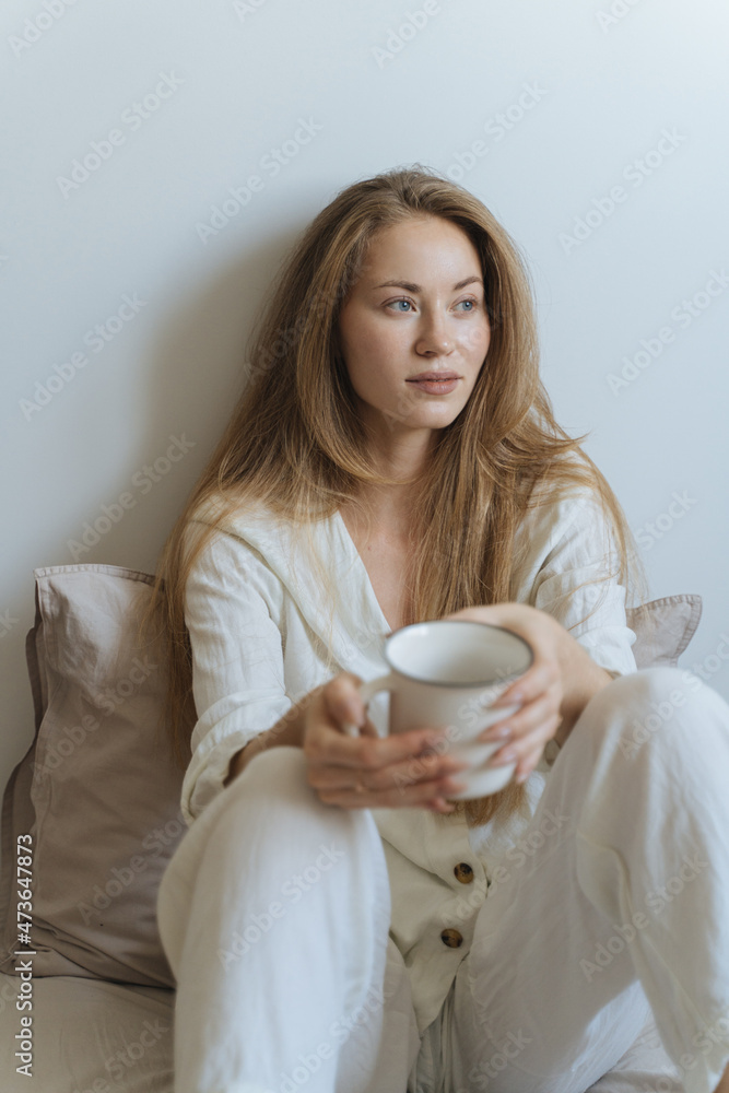 young woman in bed uses smartphone young woman in bed uses smartphone