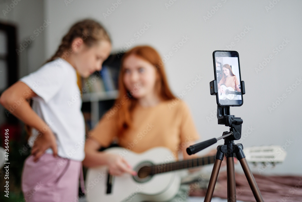 Blur of cheerful girls studying and live streaming Blur of cheerful girls studying and live streaming