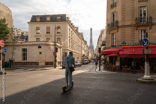 Man Crossing Street With Eiffel Tower View photo