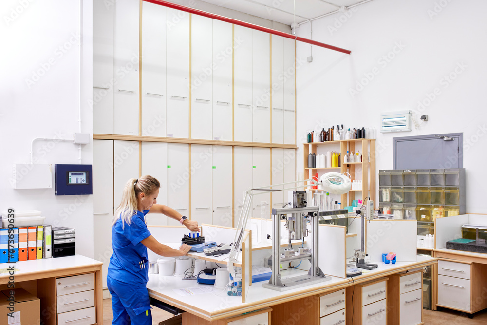 Scientist checking plastic bottles in lab