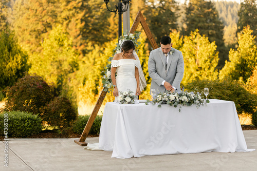 Bride and Groom Praying before Dinner photo