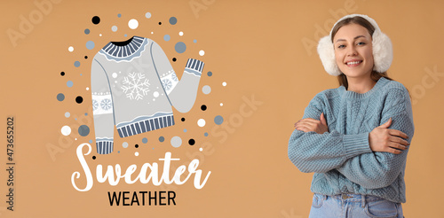 Happy young woman in warm s...
