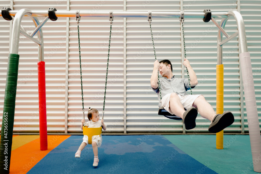 Asian baby and dad swinging Asian baby and dad swinging