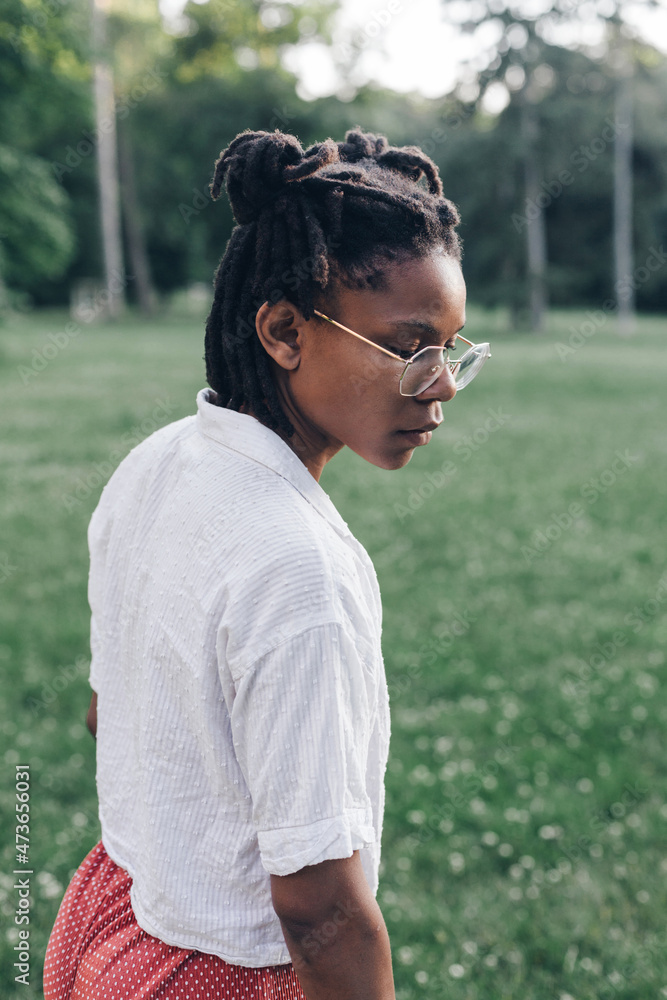 Portrait of an African American woman in park Portrait of an African American woman in park