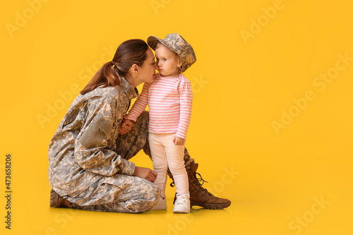 Female soldier with her lit...
