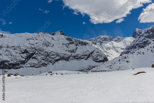 Trekking in winter season. Snowed mountains in La Egorda Valley, Cajón del Maipo, central Andes mountain range, Chile